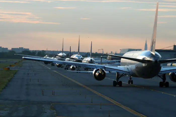 Airplanes lined up on the tarmac at JFK Airport.